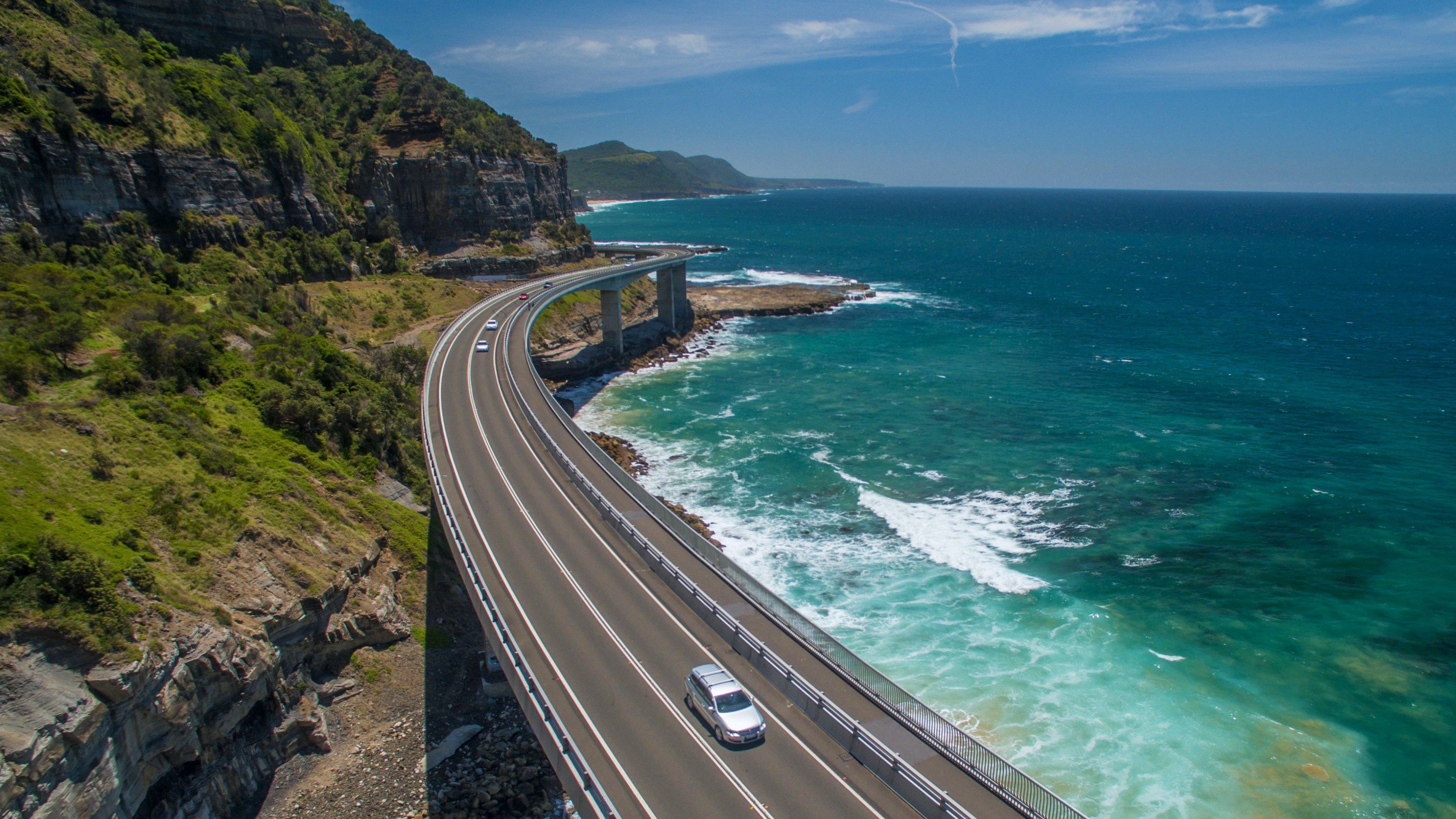 Вдоль побережья тянется. Шоссе Лос Анджелес Сан Франциско. Дорога Pacific Coast Highway. Тихоокеанское шоссе Калифорния. Sea Cliff Bridge Вуллонгонг.