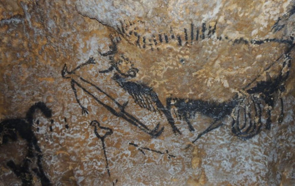 Наскальные рисунки древних людей с динозаврами